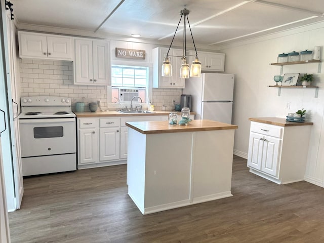 kitchen featuring white cabinets, white appliances, and wooden counters