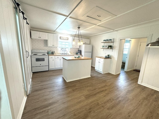 kitchen featuring dark wood-type flooring, white appliances, a sink, and white cabinetry