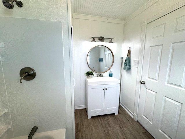 full bathroom with wood finished floors and vanity
