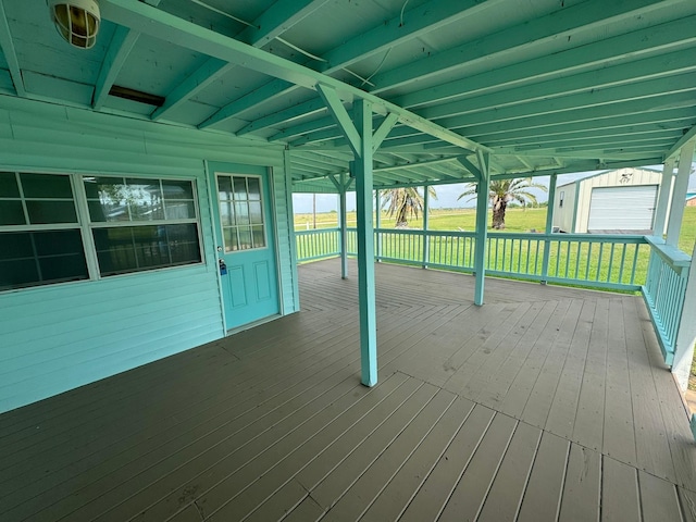 wooden deck with an outbuilding