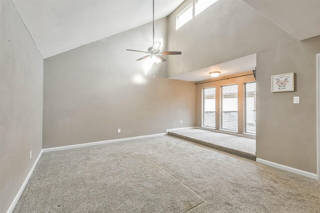 interior space with high vaulted ceiling, baseboards, a ceiling fan, and carpet