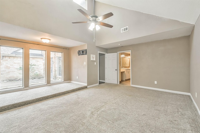 unfurnished living room with high vaulted ceiling, ceiling fan, light carpet, baseboards, and visible vents