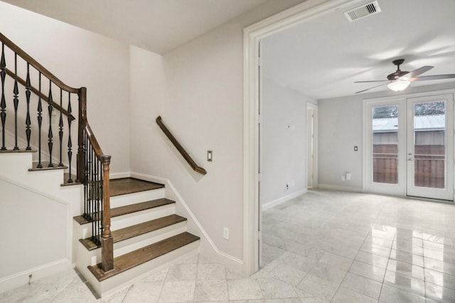 1129 W 21st St, Houston, TX 77008 - stairway featuring french doors, visible vents, tile patterned flooring, a ceiling fan, and baseboards