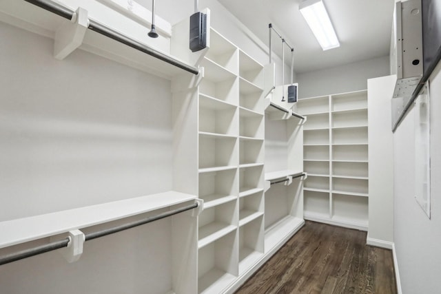 1129 W 21st St, Houston, TX 77008 - walk in closet featuring dark wood-type flooring