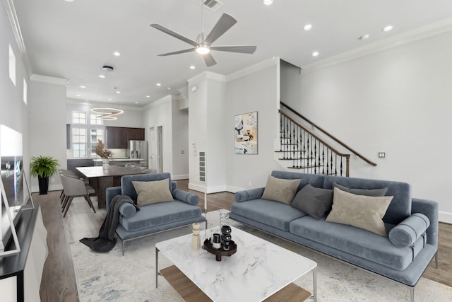 1129 W 21st St, Houston, TX 77008 - living area with baseboards, recessed lighting, crown molding, and wood finished floors
