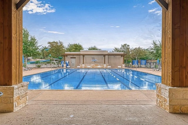 community pool featuring a patio area