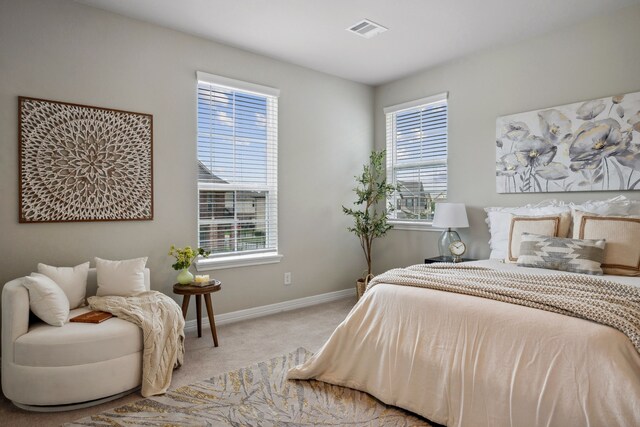 9408 Caddo Ridge Ln, Cypress, TX 77433 - bedroom with light carpet and multiple windows