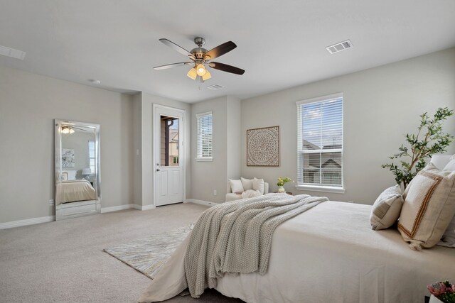 9408 Caddo Ridge Ln, Cypress, TX 77433 - bedroom with multiple windows, light colored carpet, and ceiling fan
