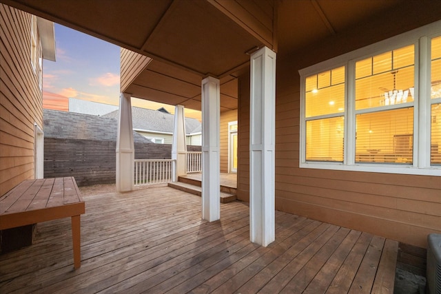deck at dusk with fence