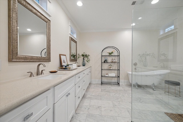 bathroom featuring recessed lighting, marble finish floor, visible vents, vanity, and a freestanding tub
