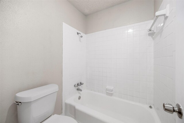 6231 Westward St Unit 20, Houston, TX 77081 - bathroom with toilet, a textured ceiling, and tub / shower combination