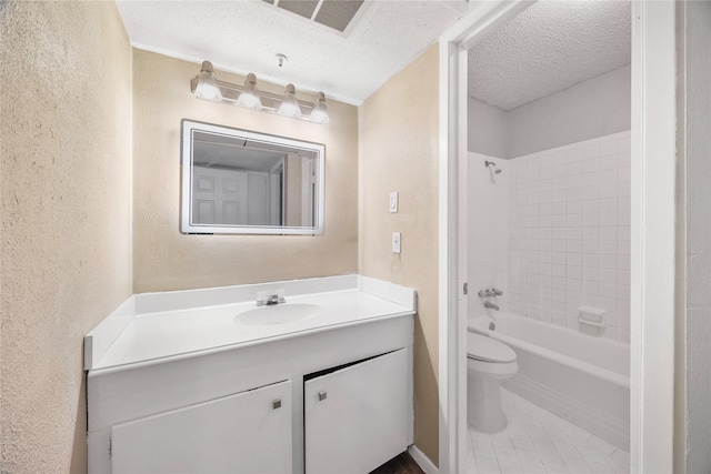 6231 Westward St Unit 20, Houston, TX 77081 - full bathroom with a textured wall, visible vents, toilet, shower / bath combination, and vanity