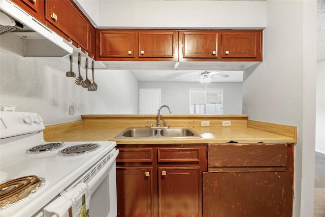 6231 Westward St Unit 20, Houston, TX 77081 - kitchen featuring a sink, light countertops, under cabinet range hood, white electric range, and a ceiling fan