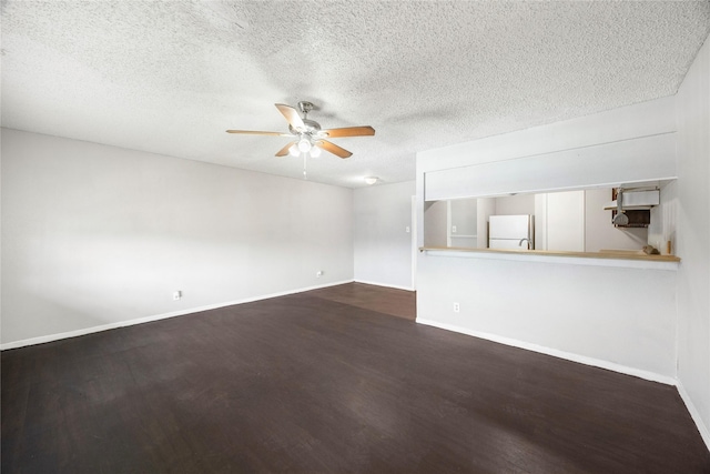 6231 Westward St Unit 20, Houston, TX 77081 - unfurnished living room with a textured ceiling, wood finished floors, a ceiling fan, and baseboards
