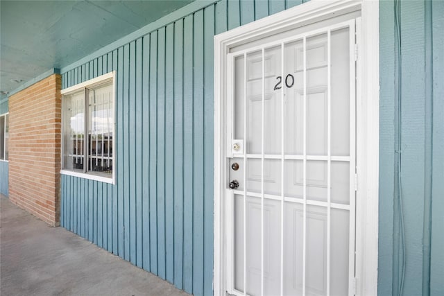 6231 Westward St Unit 20, Houston, TX 77081 - view of exterior entry with board and batten siding