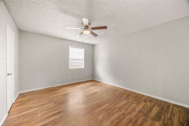 6231 Westward St Unit 20, Houston, TX 77081 - unfurnished room with baseboards, ceiling fan, light wood-style floors, and a textured ceiling