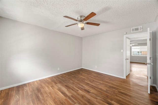 6231 Westward St Unit 20, Houston, TX 77081 - spare room featuring a textured ceiling, visible vents, ceiling fan, baseboards, and wood finished floors