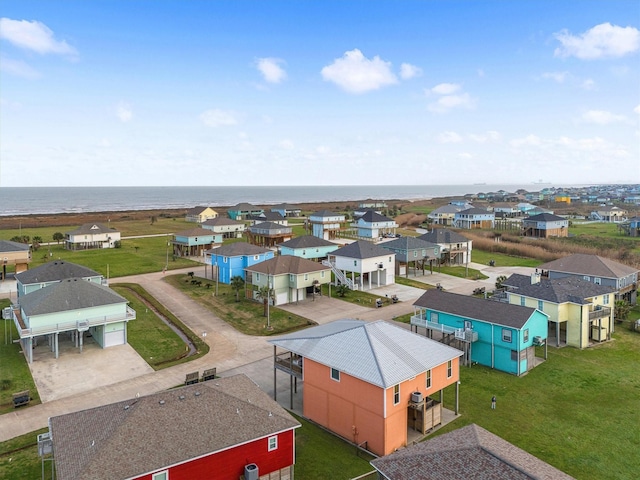 drone / aerial view with a water view and a residential view