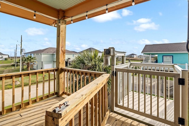 wooden terrace featuring a residential view