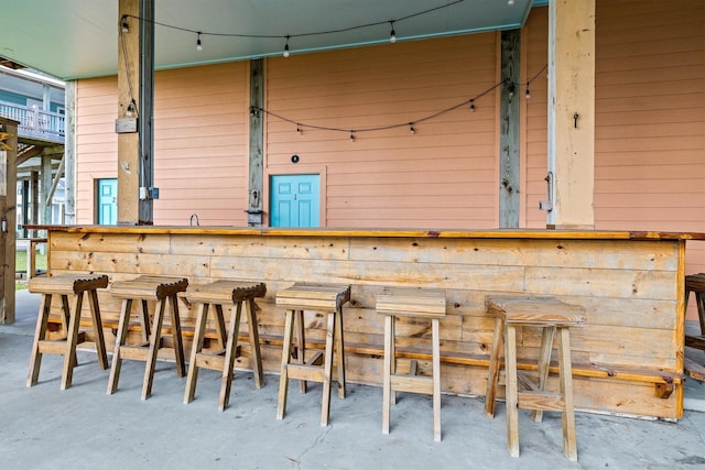 bar featuring concrete flooring