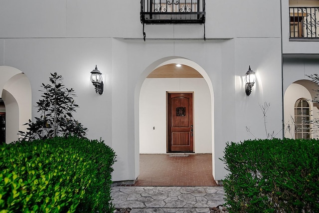 doorway to property with stucco siding