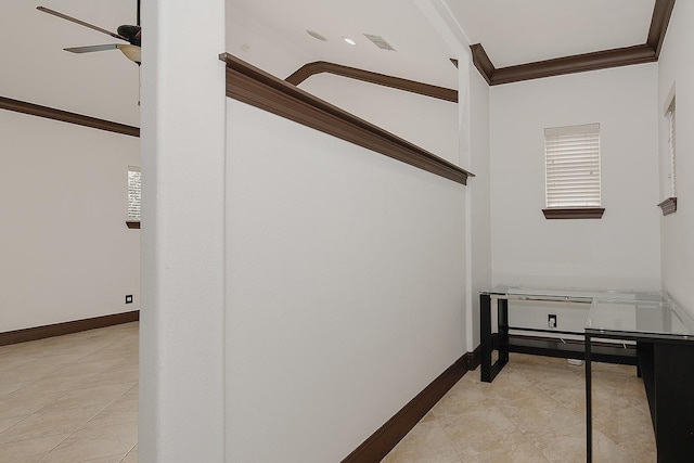 stairway featuring crown molding, ceiling fan, visible vents, and plenty of natural light