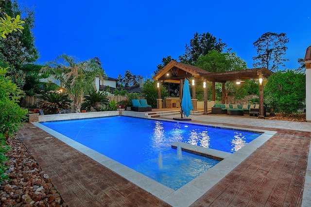 view of swimming pool with a fenced in pool, a fenced backyard, outdoor lounge area, and a patio