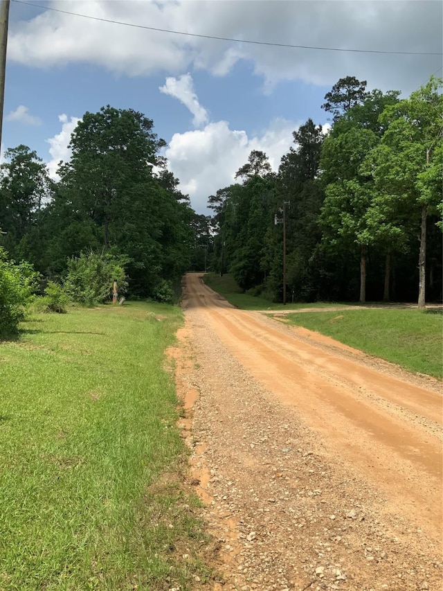 view of road featuring a view of trees