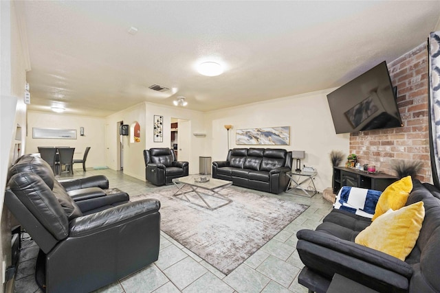 living room featuring light tile patterned floors and visible vents