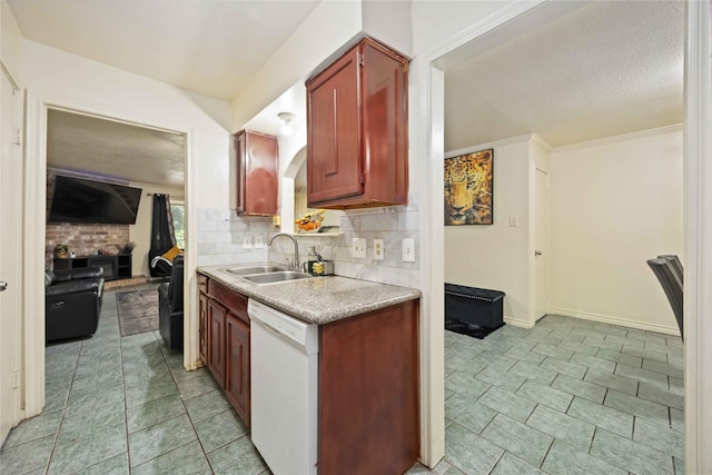 kitchen featuring decorative backsplash, light countertops, dark brown cabinets, dishwasher, and a sink