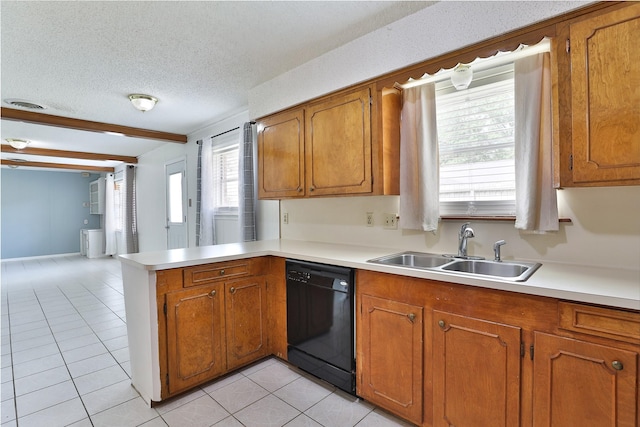 kitchen with a peninsula, a sink, brown cabinets, and black dishwasher