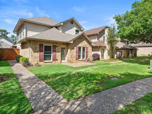 6729 Tournament Dr, Houston, TX 77069 - rear view of property with a shingled roof and brick siding