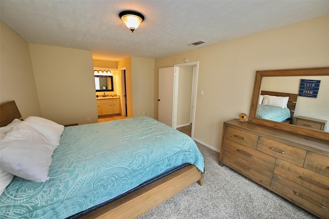 6729 Tournament Dr, Houston, TX 77069 - carpeted bedroom with ensuite bath and baseboards