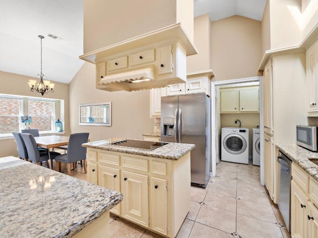 6729 Tournament Dr, Houston, TX 77069 - kitchen with cream cabinets, stainless steel appliances, high vaulted ceiling, a center island, and washing machine and clothes dryer