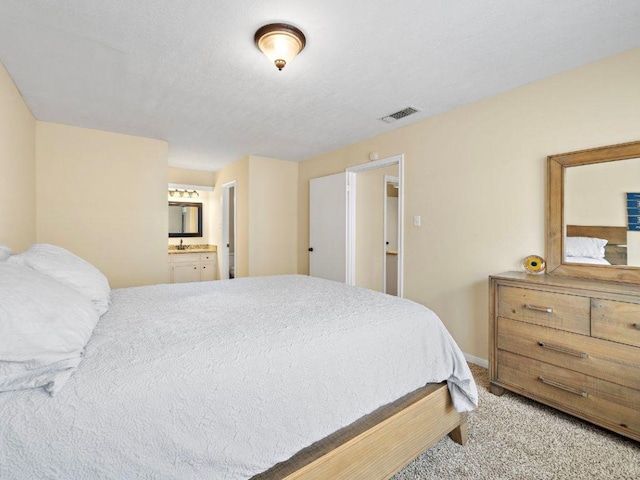 6729 Tournament Dr, Houston, TX 77069 - carpeted bedroom with ensuite bathroom and baseboards