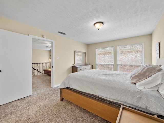 6729 Tournament Dr, Houston, TX 77069 - bedroom featuring carpet floors and a textured ceiling