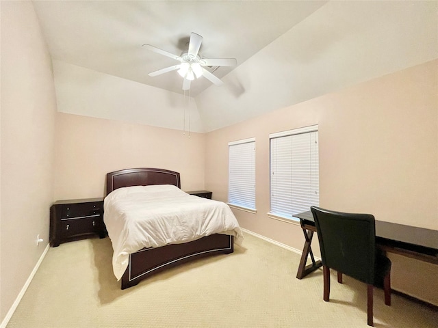 bedroom with vaulted ceiling, baseboards, a ceiling fan, and light carpet