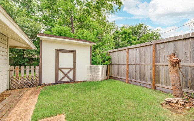 view of shed with a fenced backyard