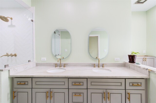 7530 Del Monte Dr, Houston, TX 77063 - full bathroom featuring double vanity, visible vents, and a sink