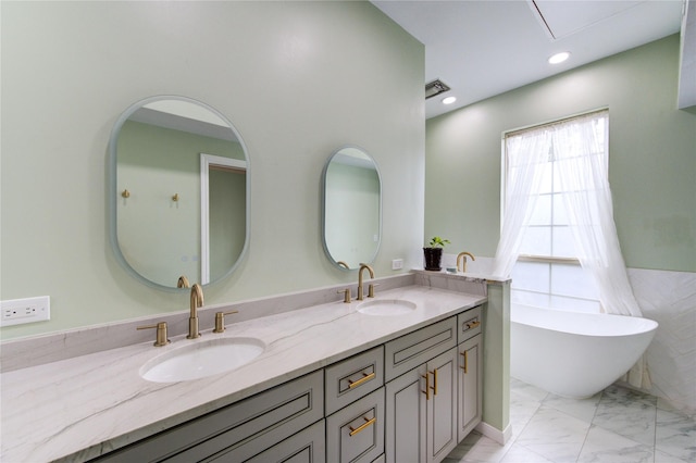 7530 Del Monte Dr, Houston, TX 77063 - full bathroom featuring double vanity, a sink, marble finish floor, and a soaking tub