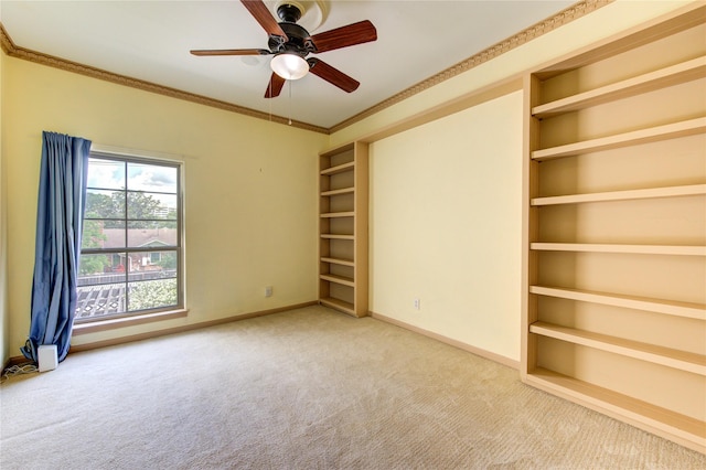 7530 Del Monte Dr, Houston, TX 77063 - carpeted empty room with a ceiling fan, baseboards, ornamental molding, and built in shelves
