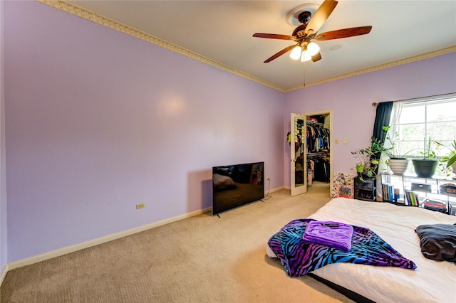 7530 Del Monte Dr, Houston, TX 77063 - bedroom with baseboards, light colored carpet, ornamental molding, and a walk in closet
