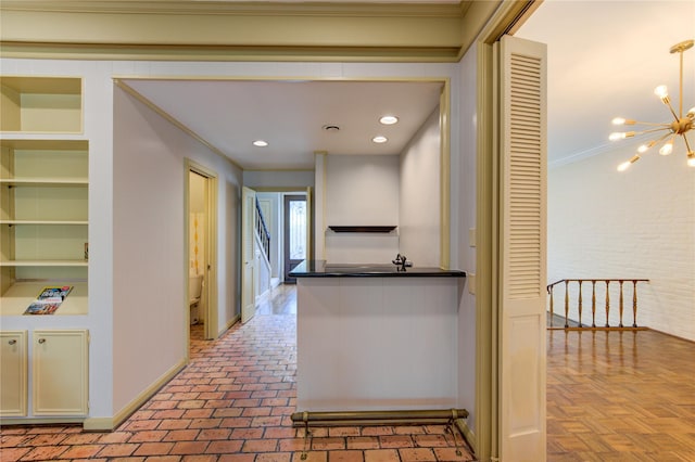 7530 Del Monte Dr, Houston, TX 77063 - hall featuring an inviting chandelier, baseboards, crown molding, and built in shelves