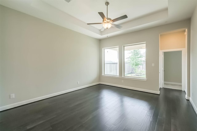 19622 Upper Canyon Ct, Cypress, TX 77433 - unfurnished room with a raised ceiling, a ceiling fan, dark wood-style floors, and baseboards