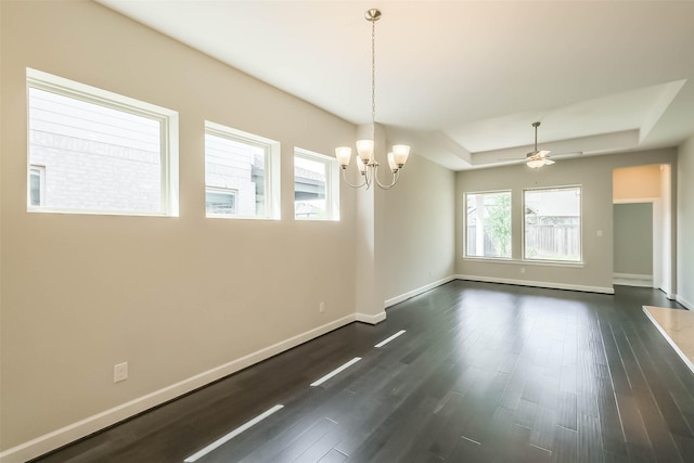 19622 Upper Canyon Ct, Cypress, TX 77433 - unfurnished room featuring baseboards, ceiling fan with notable chandelier, dark wood-type flooring, and a tray ceiling