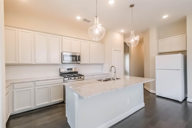 19622 Upper Canyon Ct, Cypress, TX 77433 - kitchen with dark wood-style flooring, white cabinetry, stainless steel appliances, and a sink