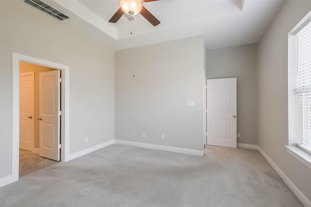 19622 Upper Canyon Ct, Cypress, TX 77433 - unfurnished room with visible vents, ceiling fan, light colored carpet, and a healthy amount of sunlight