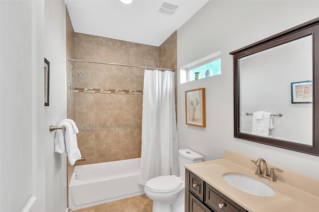 full bathroom featuring visible vents, vanity, tile patterned floors, toilet, and shower / tub combo with curtain