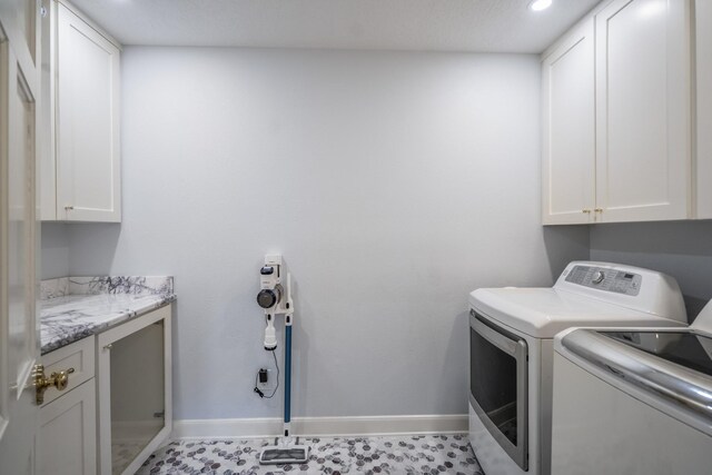 17003 Creeksouth Rd, Houston, TX 77068 - laundry room featuring cabinet space, washing machine and dryer, baseboards, and recessed lighting