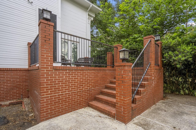 view of side of property with stairway